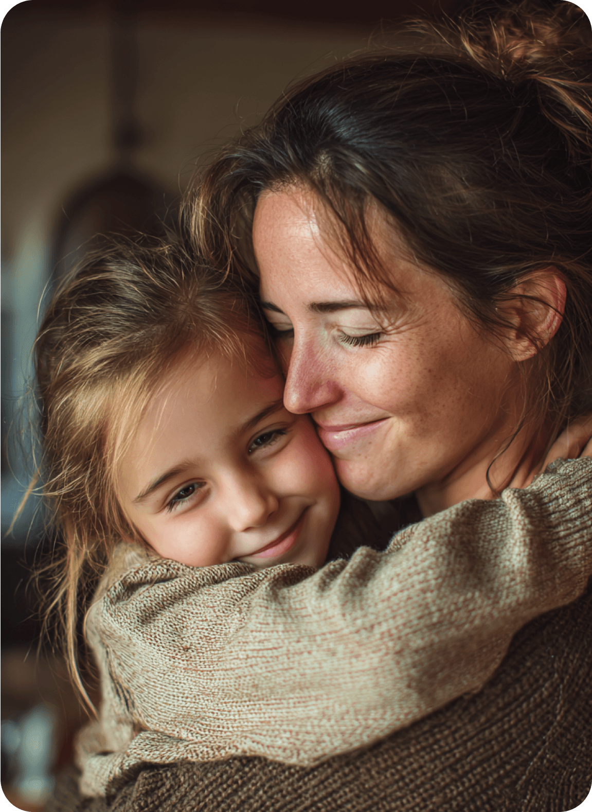 A mother holding her daughter close